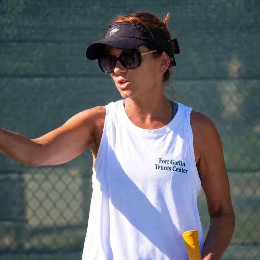 Coach Dina Meng giving instruction on court